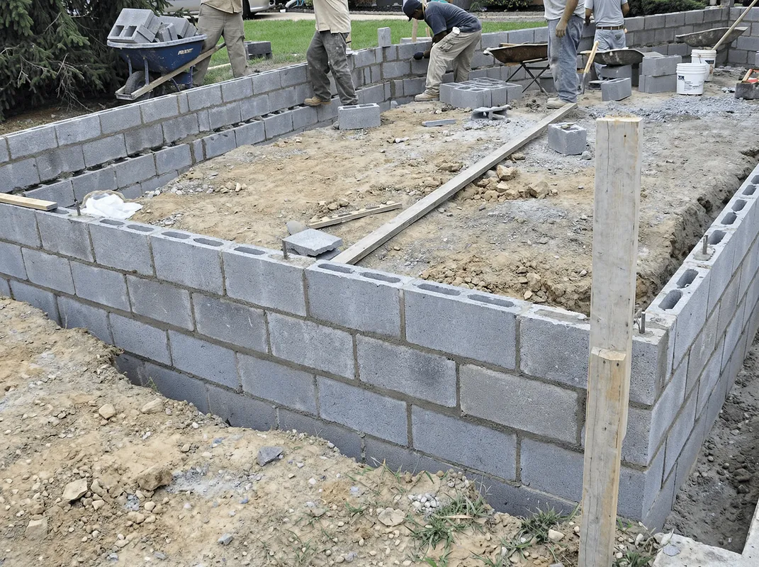 Professionals building a foundation with blocks in Eugene, OR